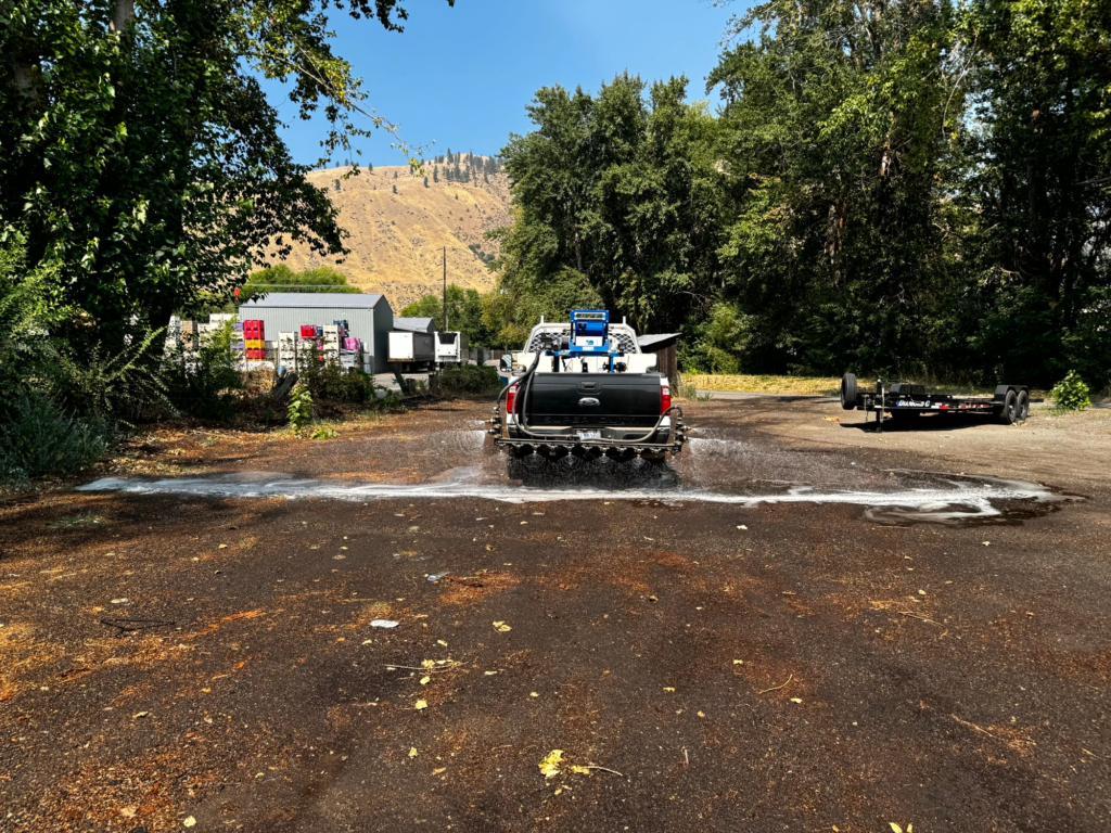 Whiteout applying liquid dust control in Cashmere Washington